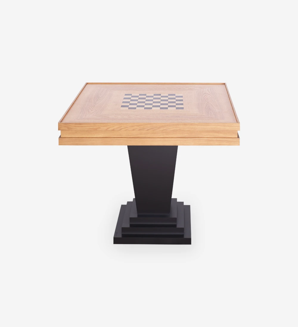 Game table with honey oak top and black lacquered foot.