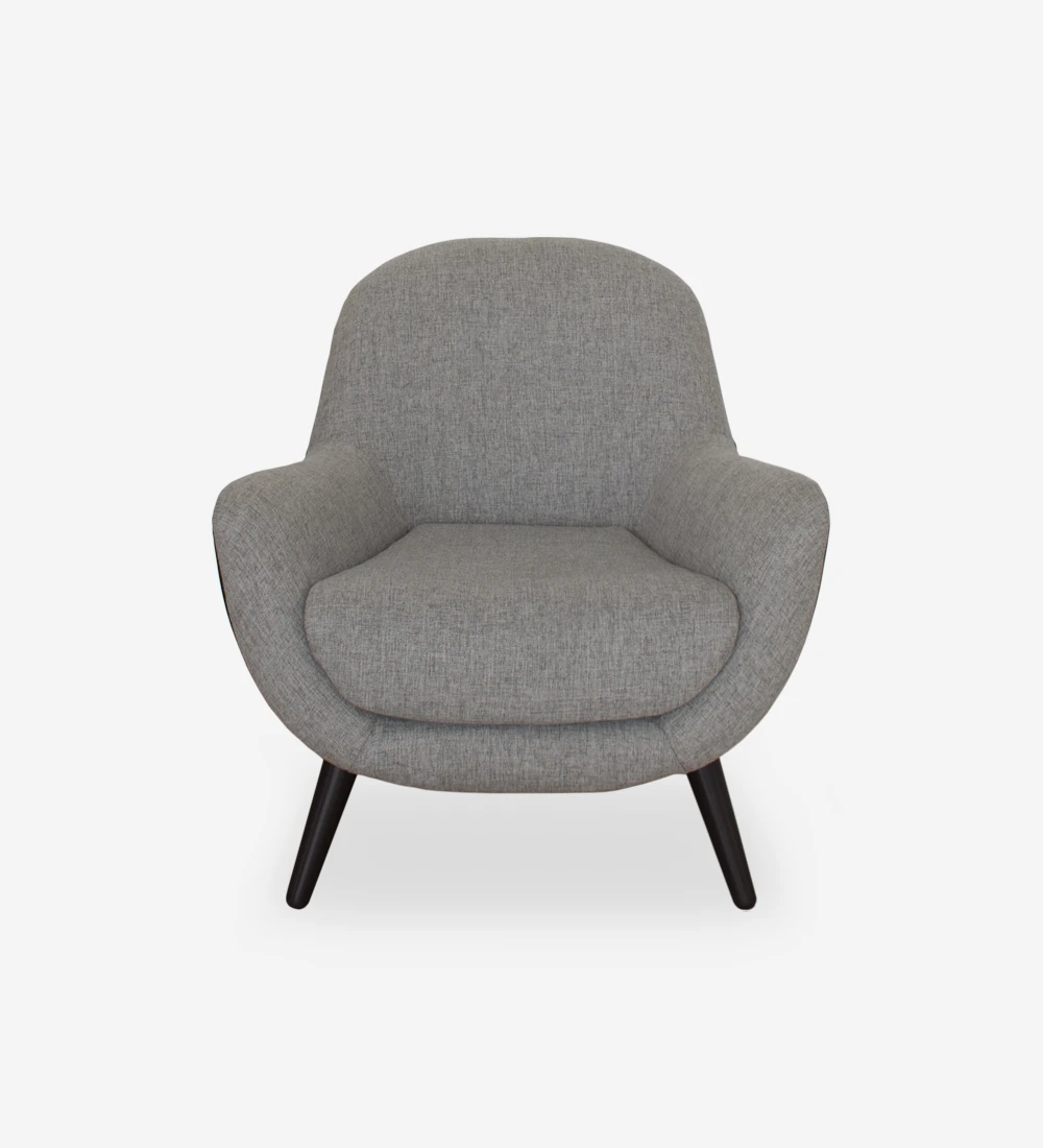 Armchair upholstered in fabric, with dark brown lacquered legs
