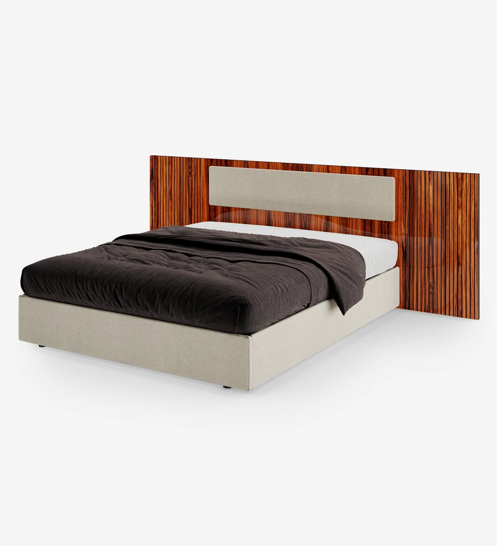 Double bed with upholstered central headboard panel, high gloss palisander headboard sides with friezes, upholstered base with storage through a lifting platform.