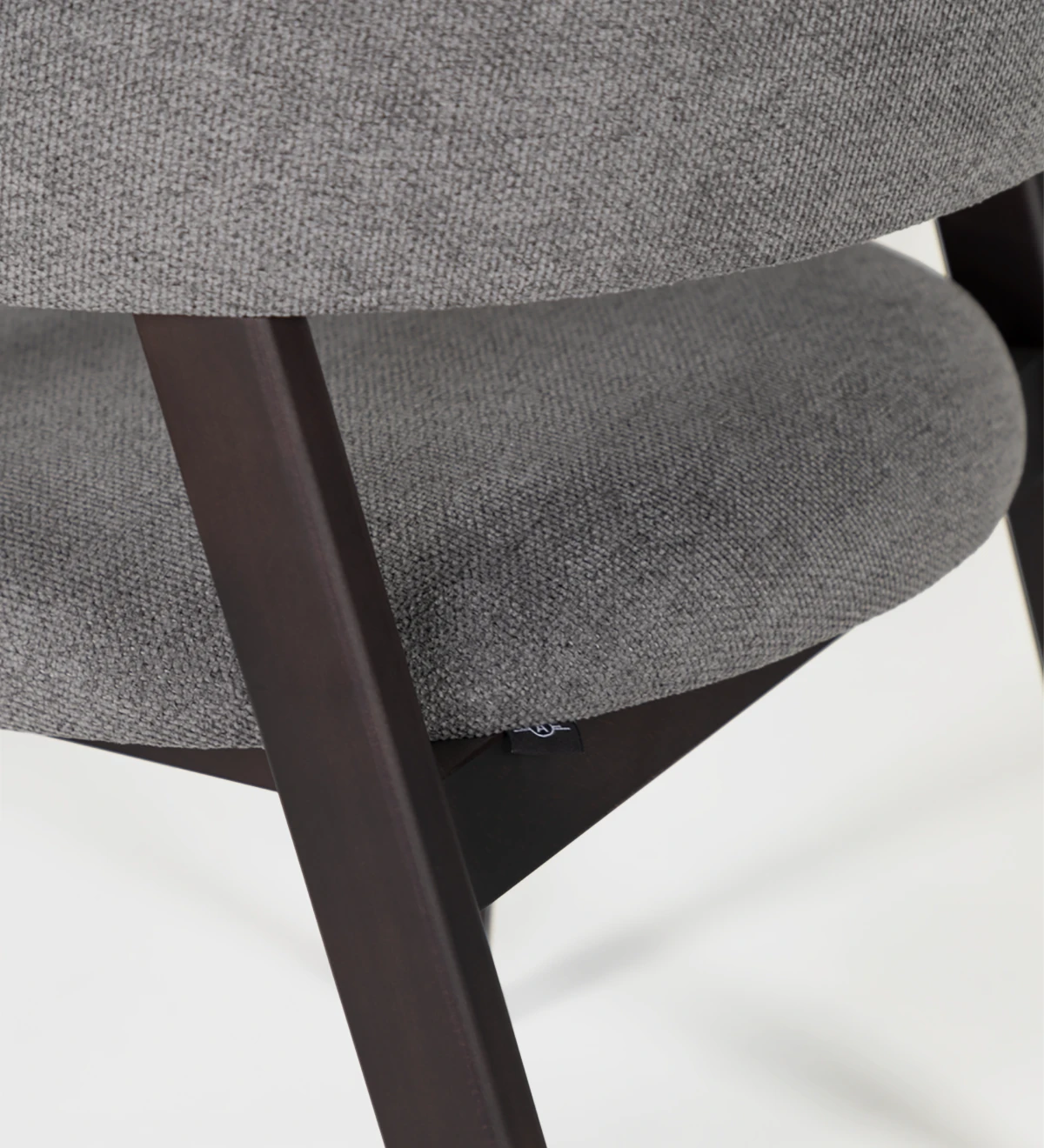 Dark brown ash wood chair with fabric upholstered armrest, seat and back.