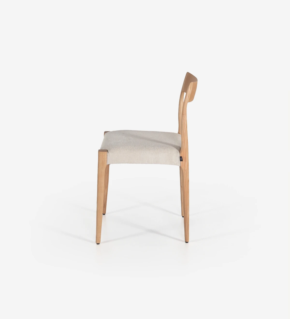Chair in natural ash wood with fabric upholstered seat.