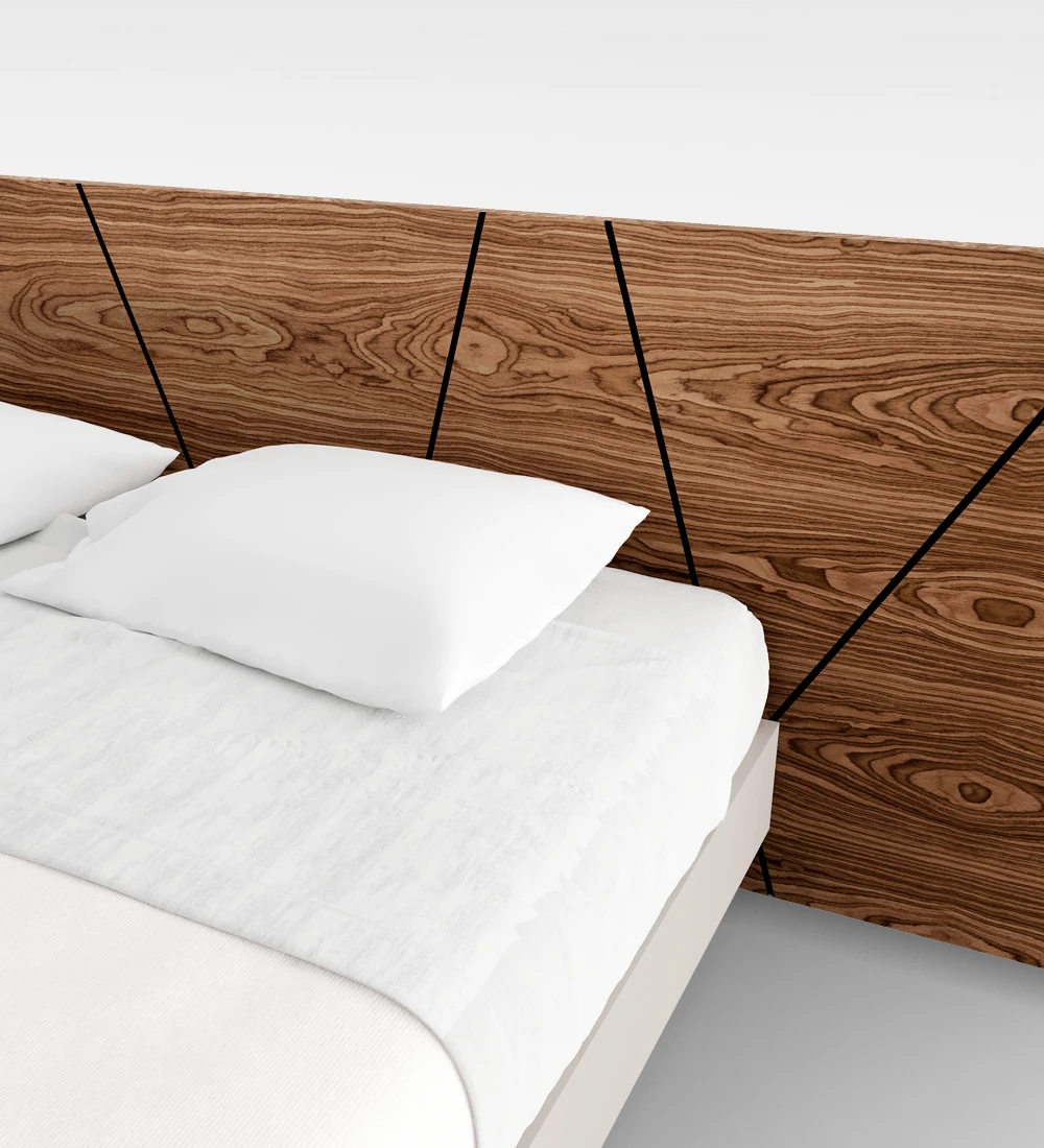 Double bed with abstract walnut headboard and suspended base in pearl.
