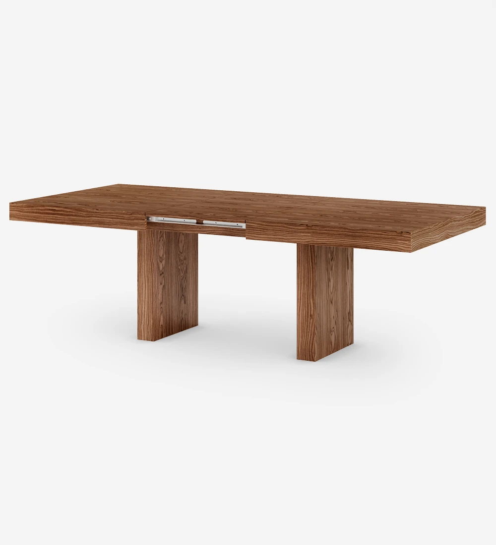 Rectangular extendable dining table in walnut.
