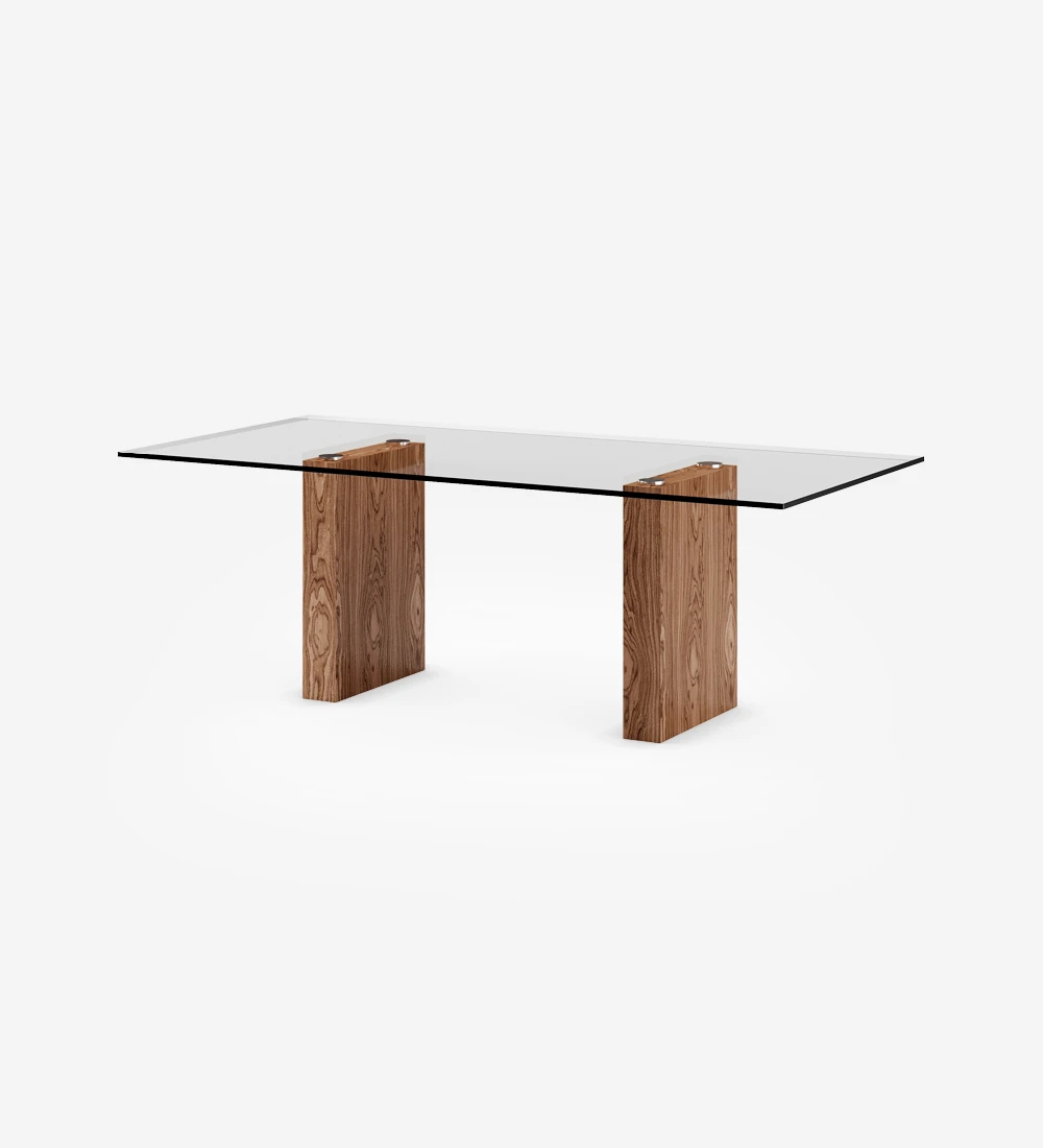 Rectangular dining table with glass top, walnut legs.