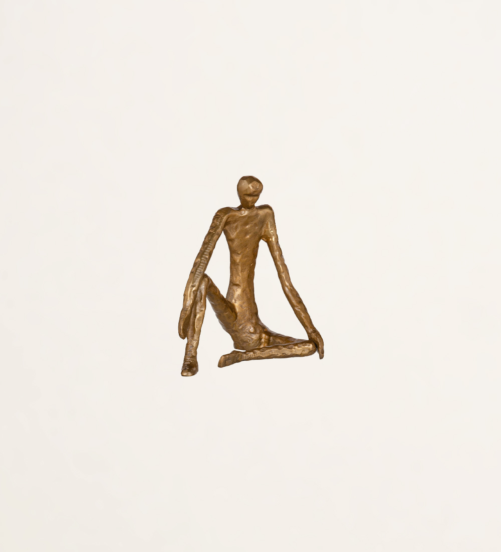 Sculpture man sitting in golden aluminum