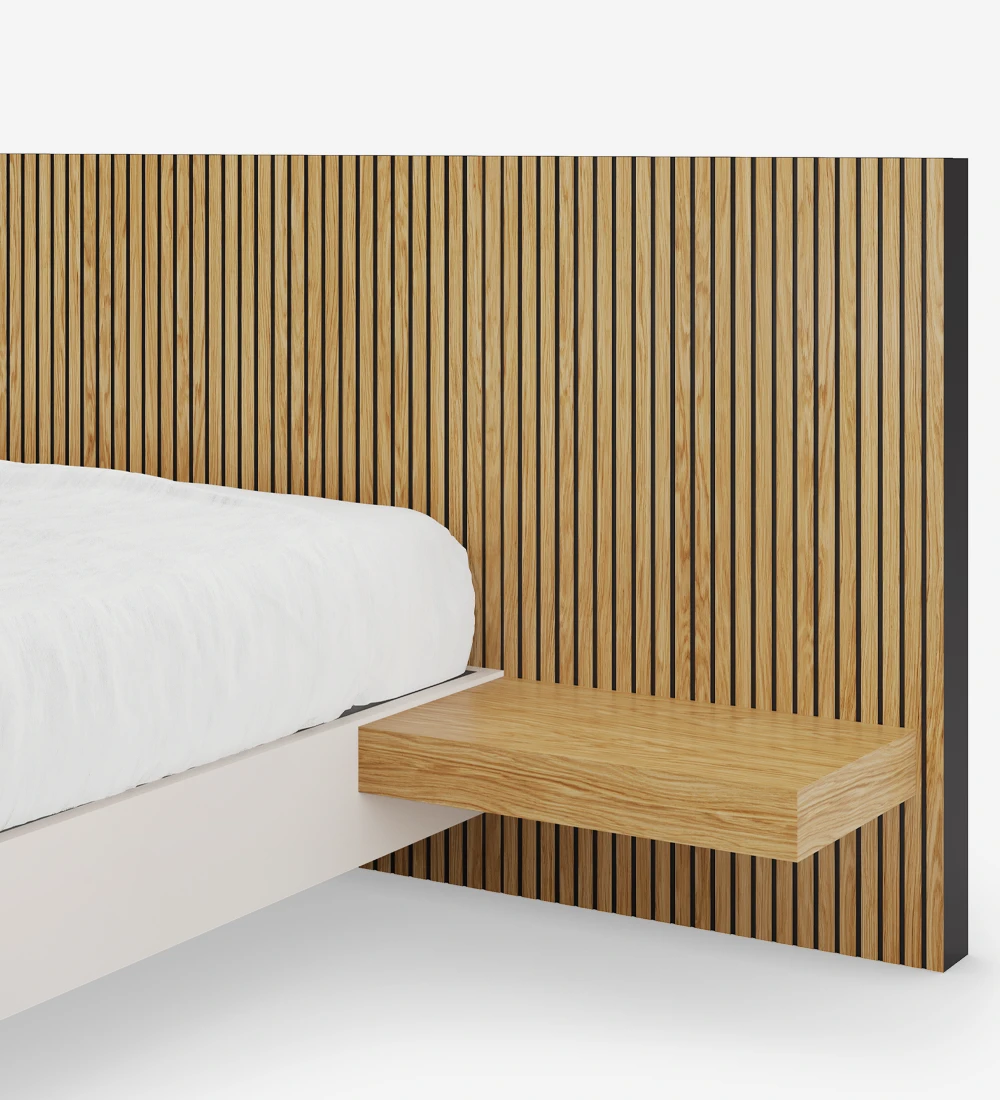 Double bed with headboard with friezes and shelves in natural oak, suspended base in pearl.