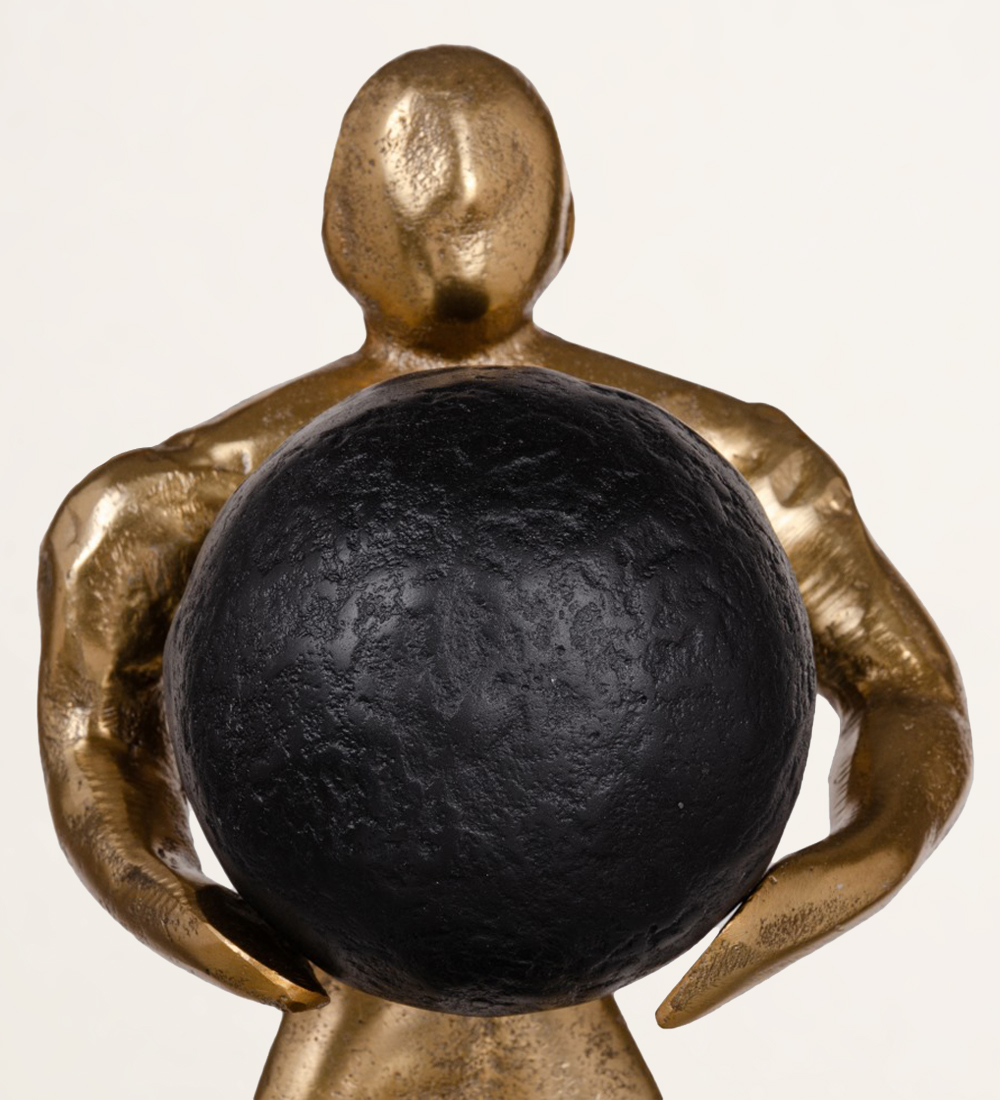 Sculpture man with ball in black and gold aluminum