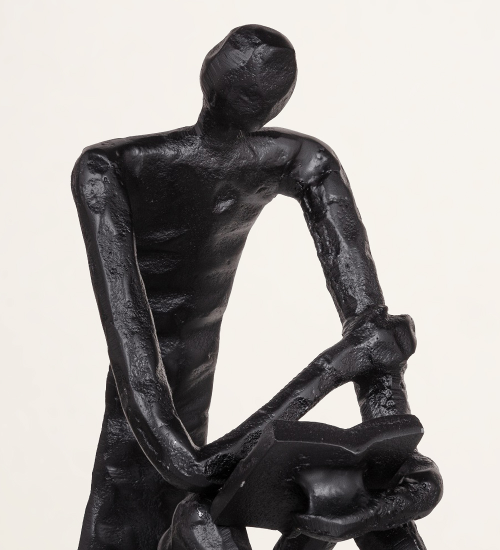 Sculpture man sitting in black aluminum