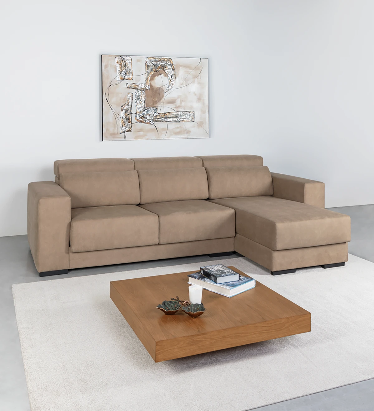 2 seater sofa with reversible chaise longue, upholstered in fabric, with reclining headrests, sliding seats, and storage on the chaise longue.