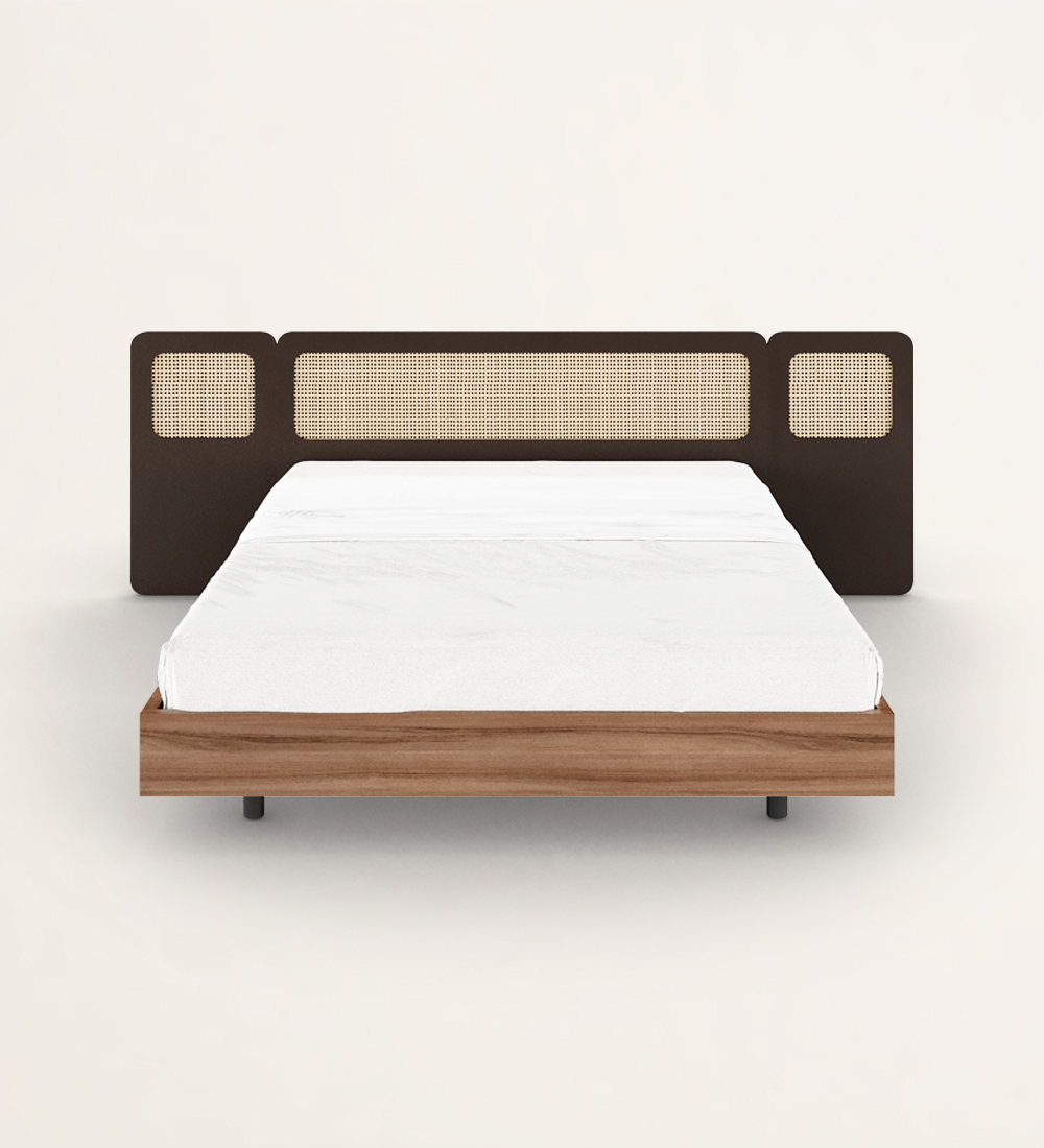Double bed in walnut, dark brown lacquered headboard with rattan detail and suspended base.