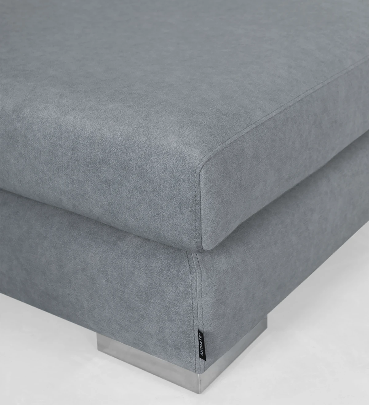 Puff upholstered in fabric.