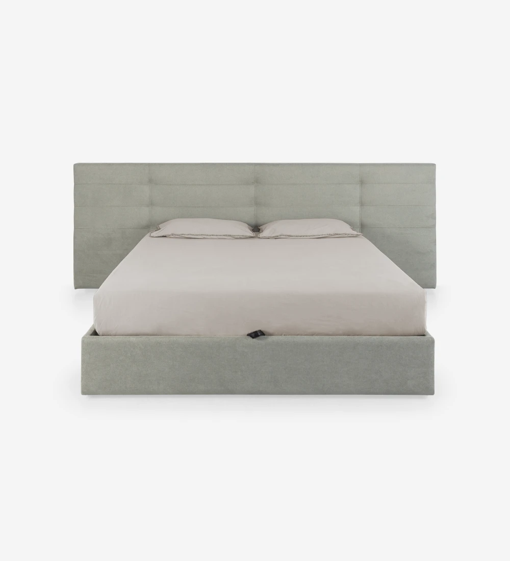 Lit double avec longue tête de lit, rembourrée en tissu, avec rangement grâce au cadre de lit relevable.