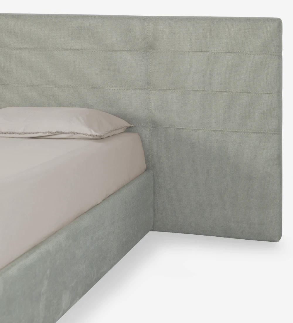 Lit double avec longue tête de lit, rembourrée en tissu, avec rangement grâce au cadre de lit relevable.