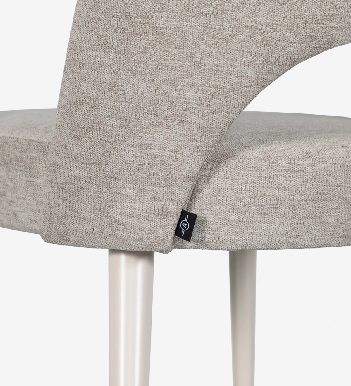 Chair upholstered in fabric, pearl lacquered feet.