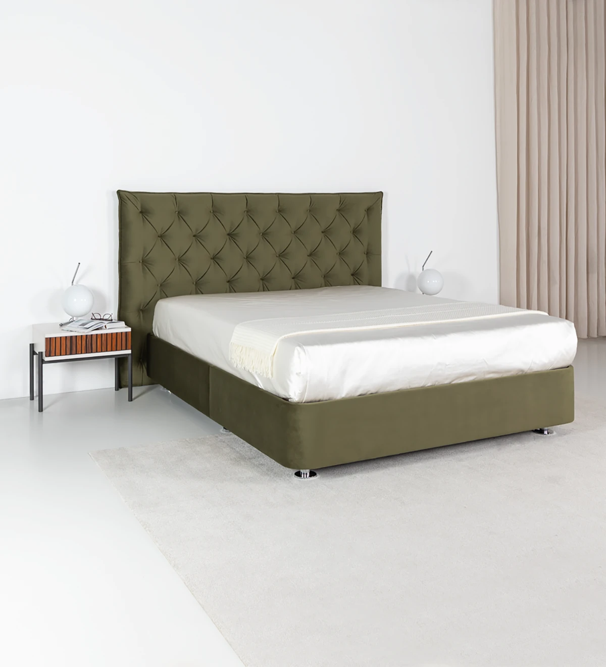 Double sommier upholstered in fabric, with lift-up bed for storage.