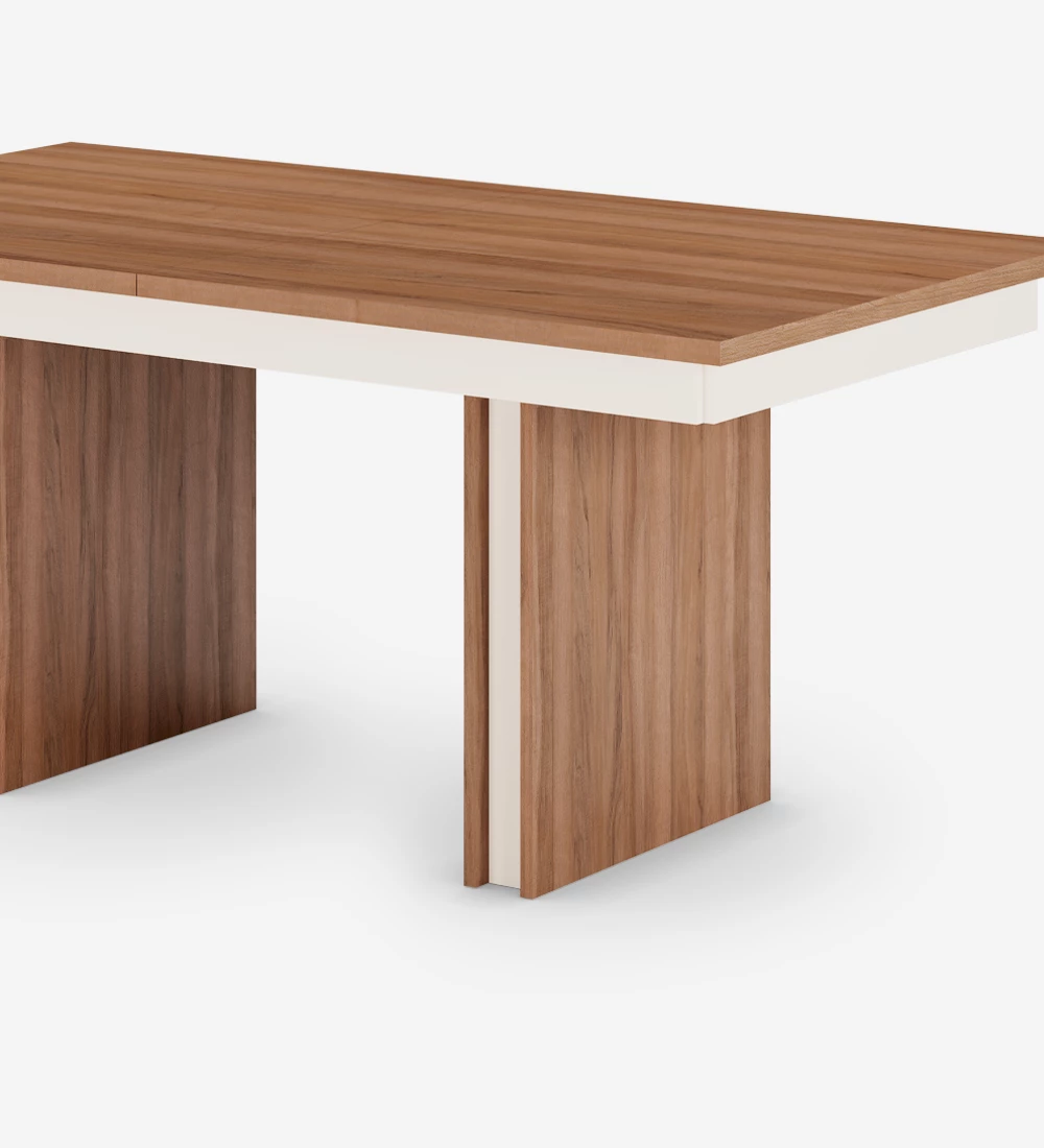 Rectangular extendable dining table in walnut and pearl detail.