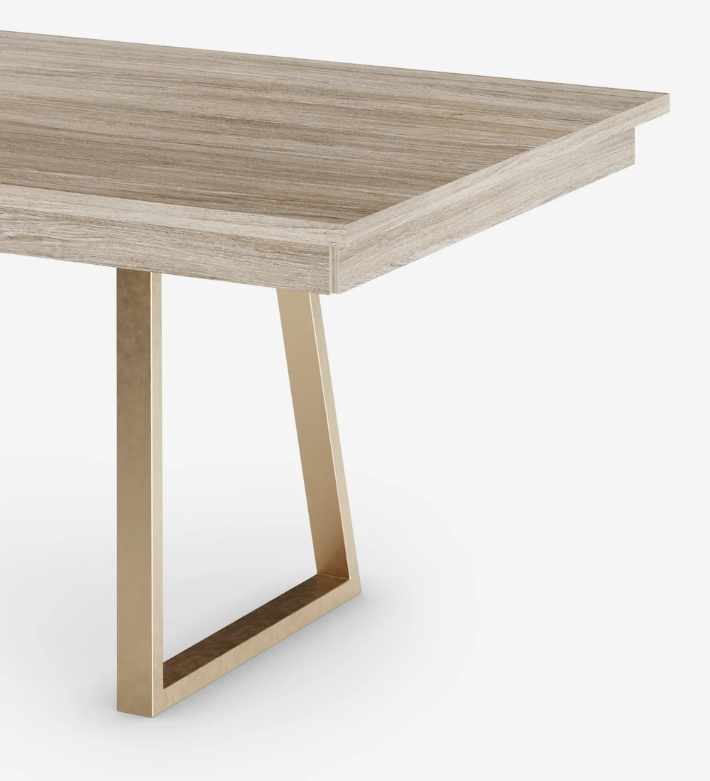 Rectangular extendable dining table with decapé oak top and golden metallic feet.