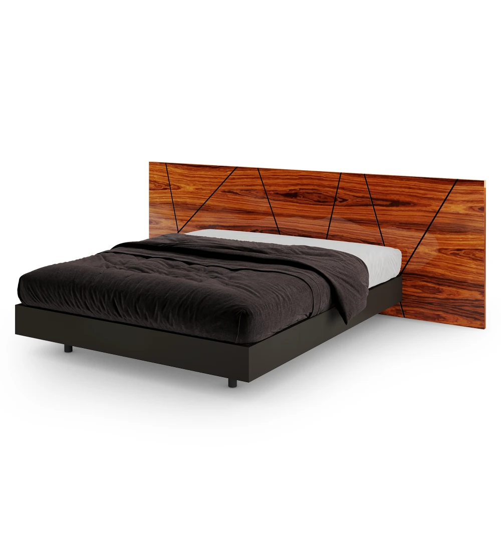 Double bed with abstract headboard in high gloss palissander and suspended base in black.