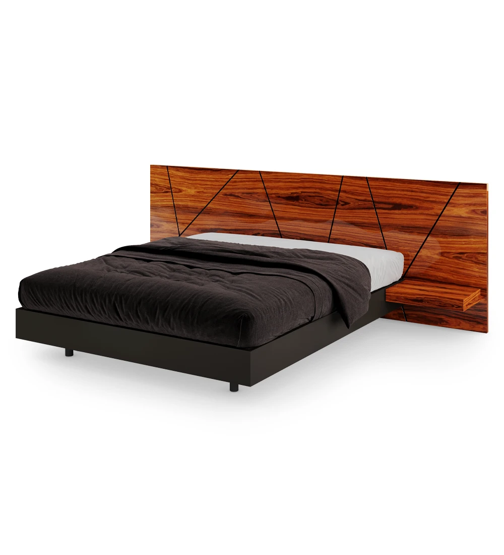 Double bed with abstract headboard and shelves in high gloss palissander, suspended base in black.