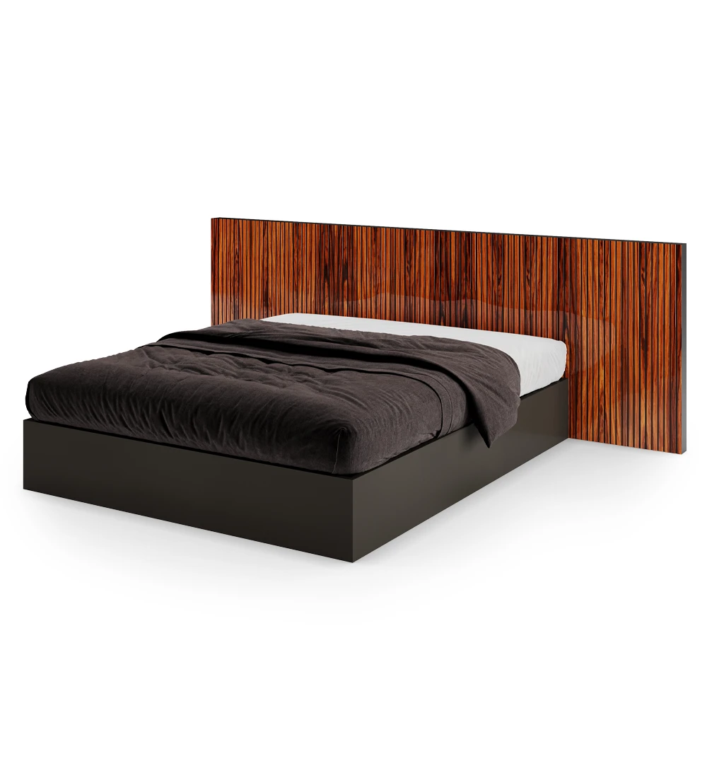 Double bed with high gloss palisander headboard with friezes and black lacquered base, with storage through a lifting platform.