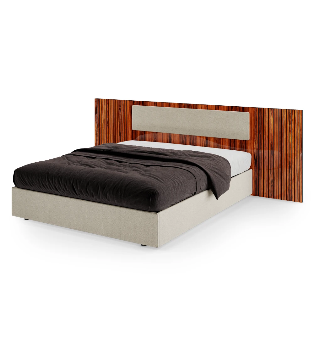 Double bed with upholstered central headboard panel, high gloss palisander headboard sides with friezes, upholstered base with storage through a lifting platform.