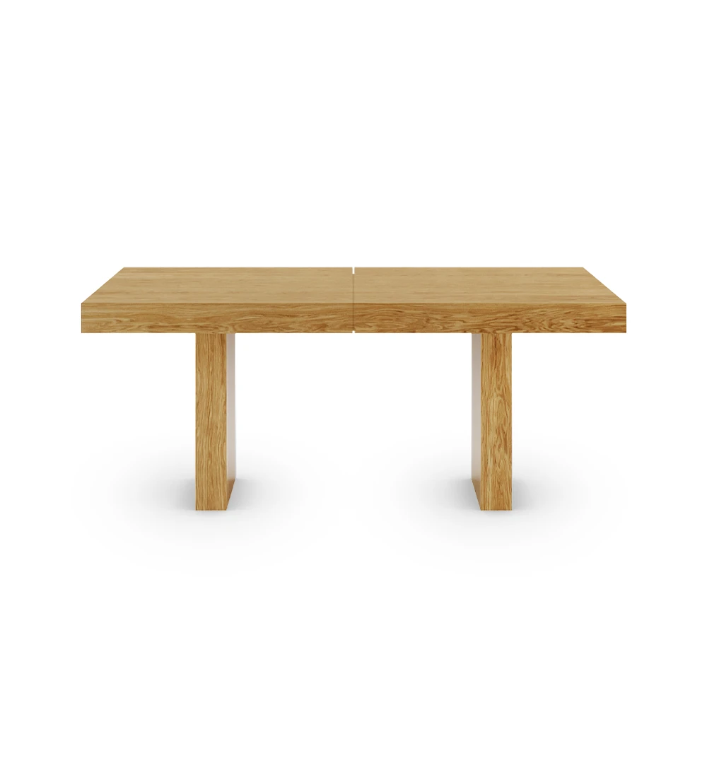 Rectangular extendable dining table in natural oak.