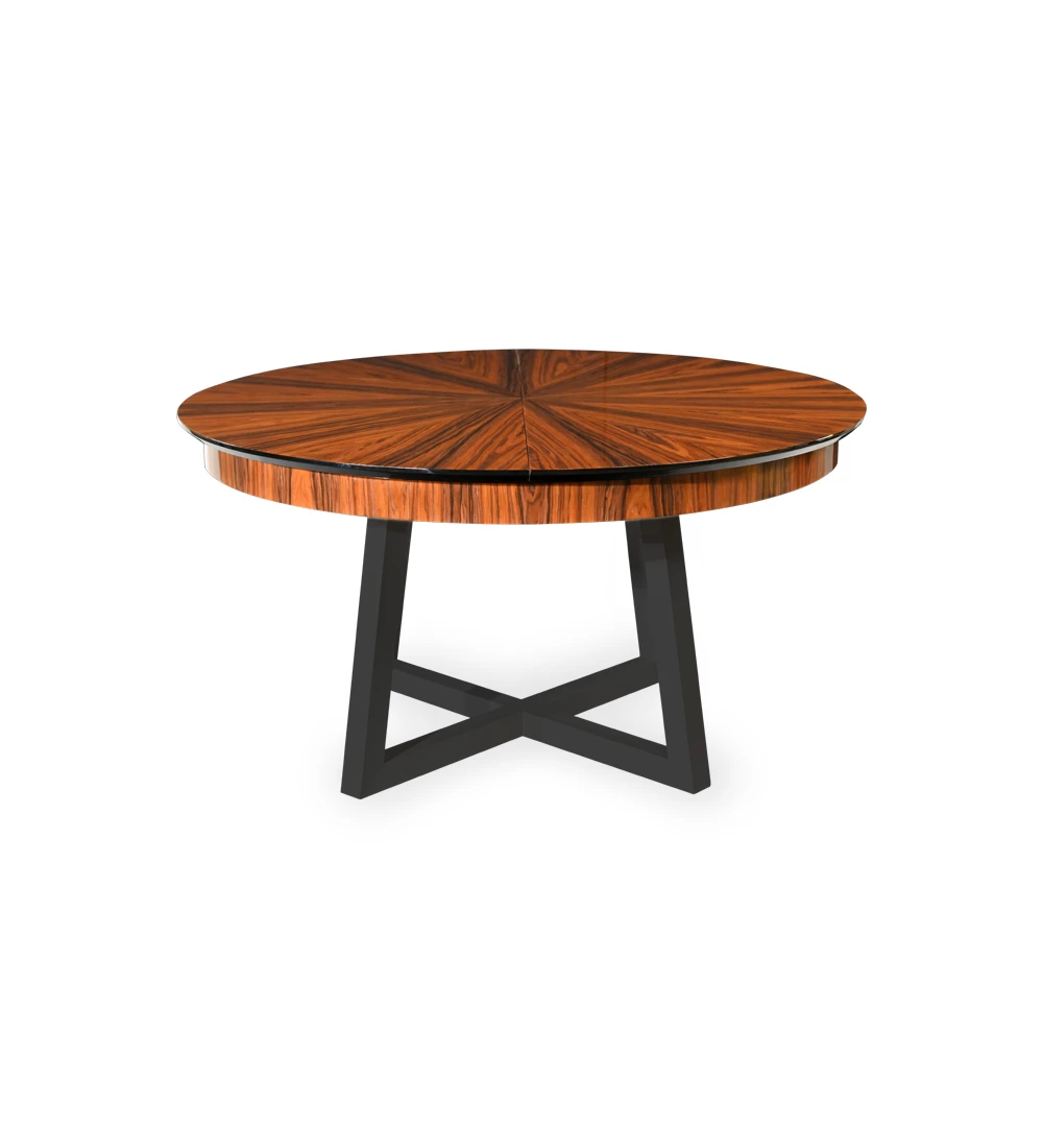 Table de salle à manger ronde extensible avec plateau à pointes en palissandre brillant et pieds laqués noirs.