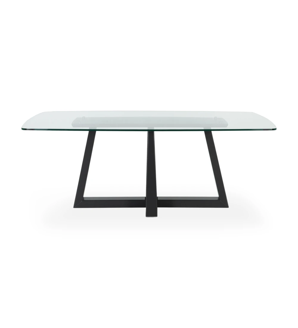 Table de repas rectangulaire avec plateau en verre et pied central laqué noir.