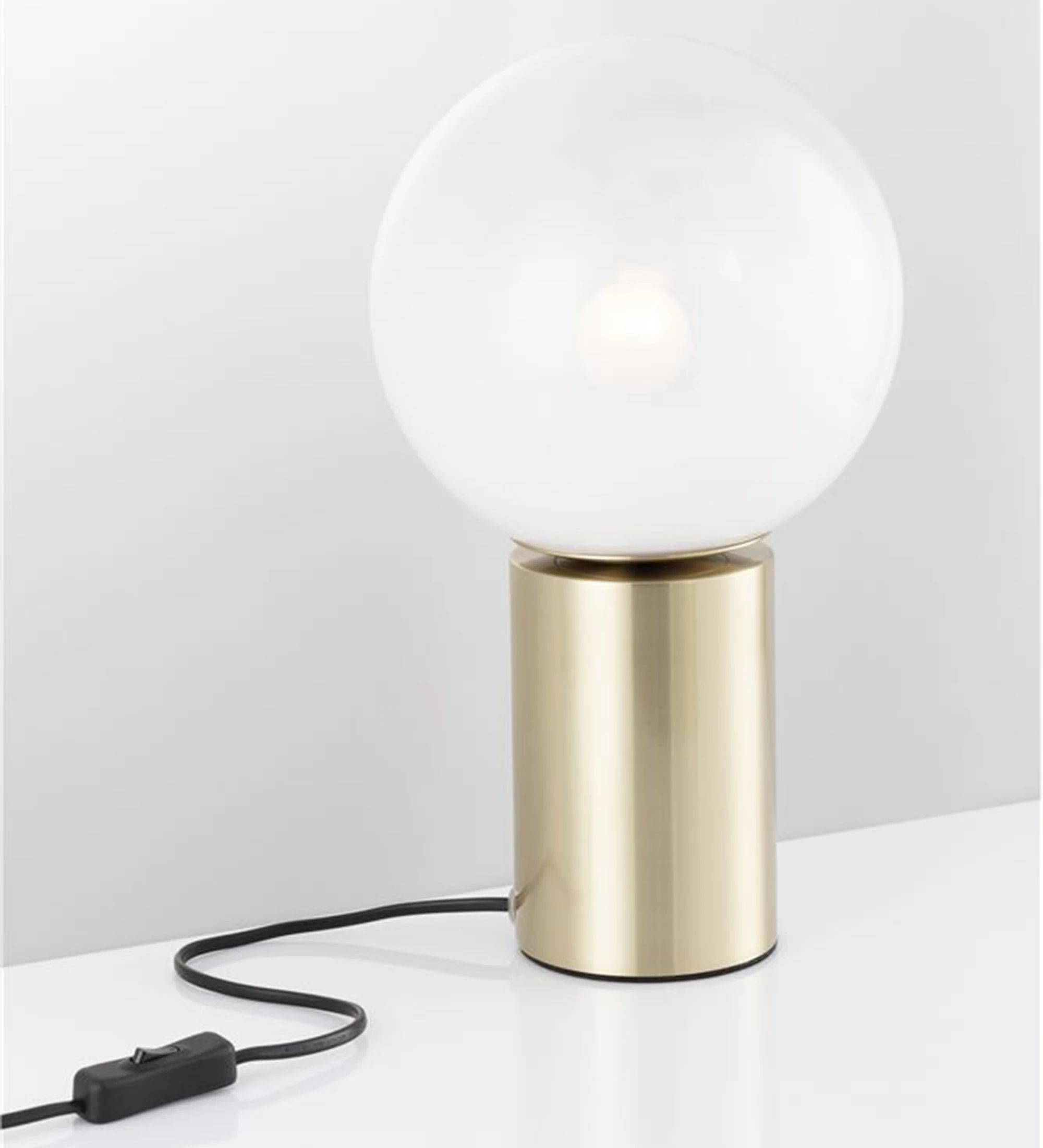 Table lamp in golden brass and frosted glass diffuser.