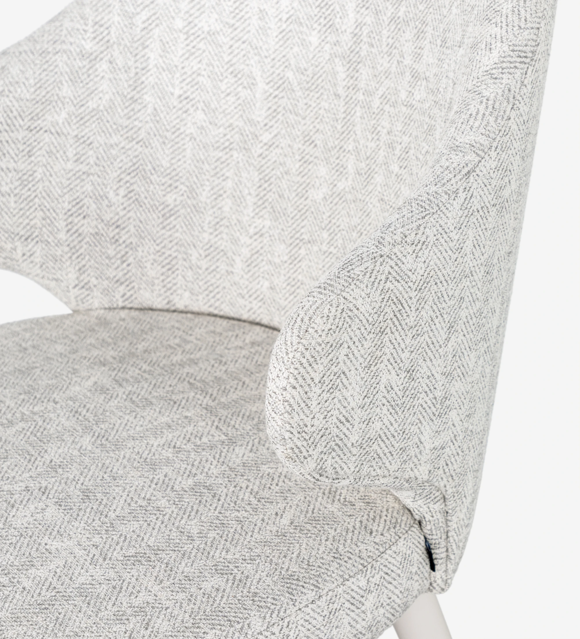 Chair upholstered in fabric, feet lacquered in pearl.