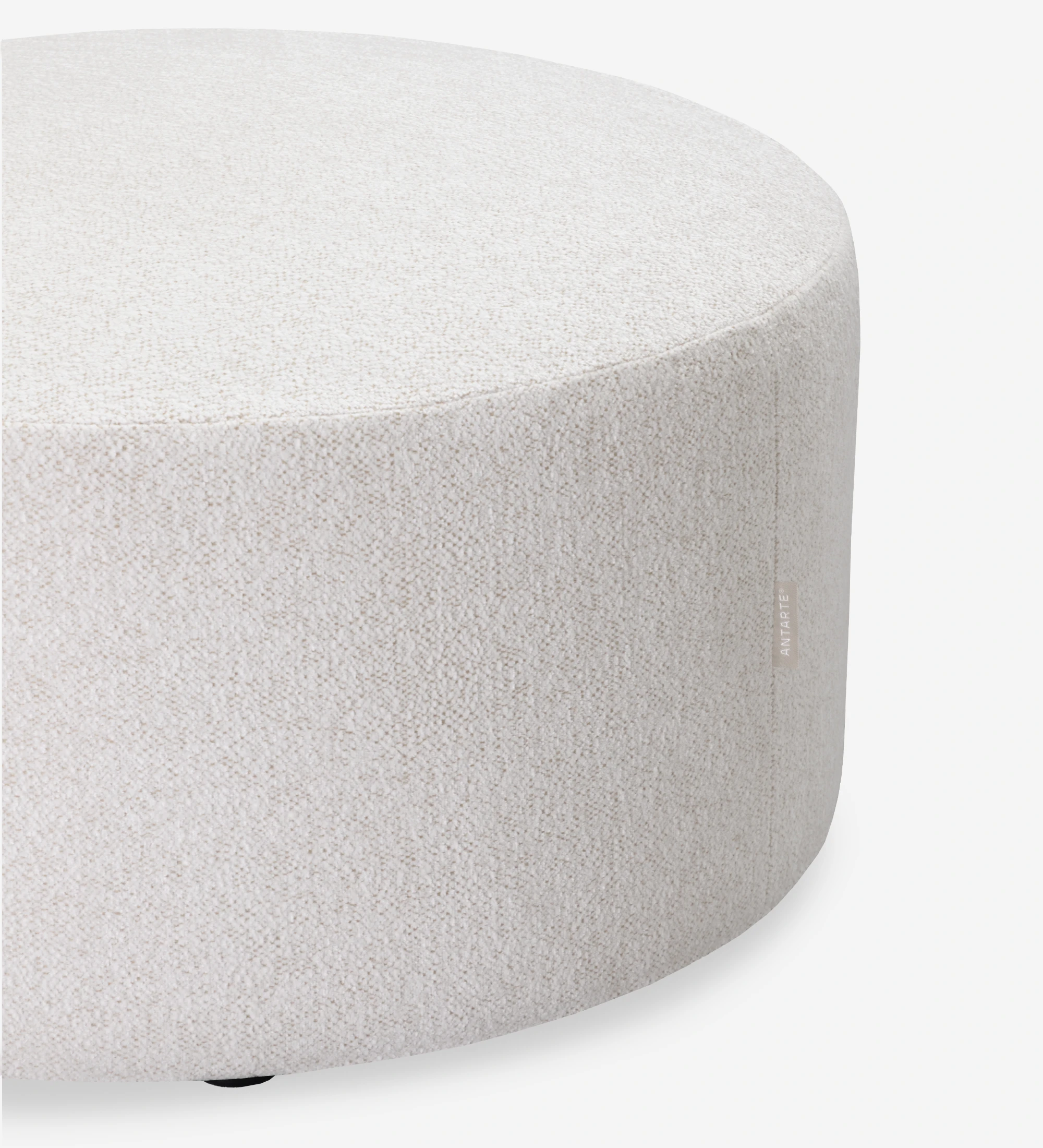 Paris round puff, upholstered in pearl fabric, Ø 73 cm.