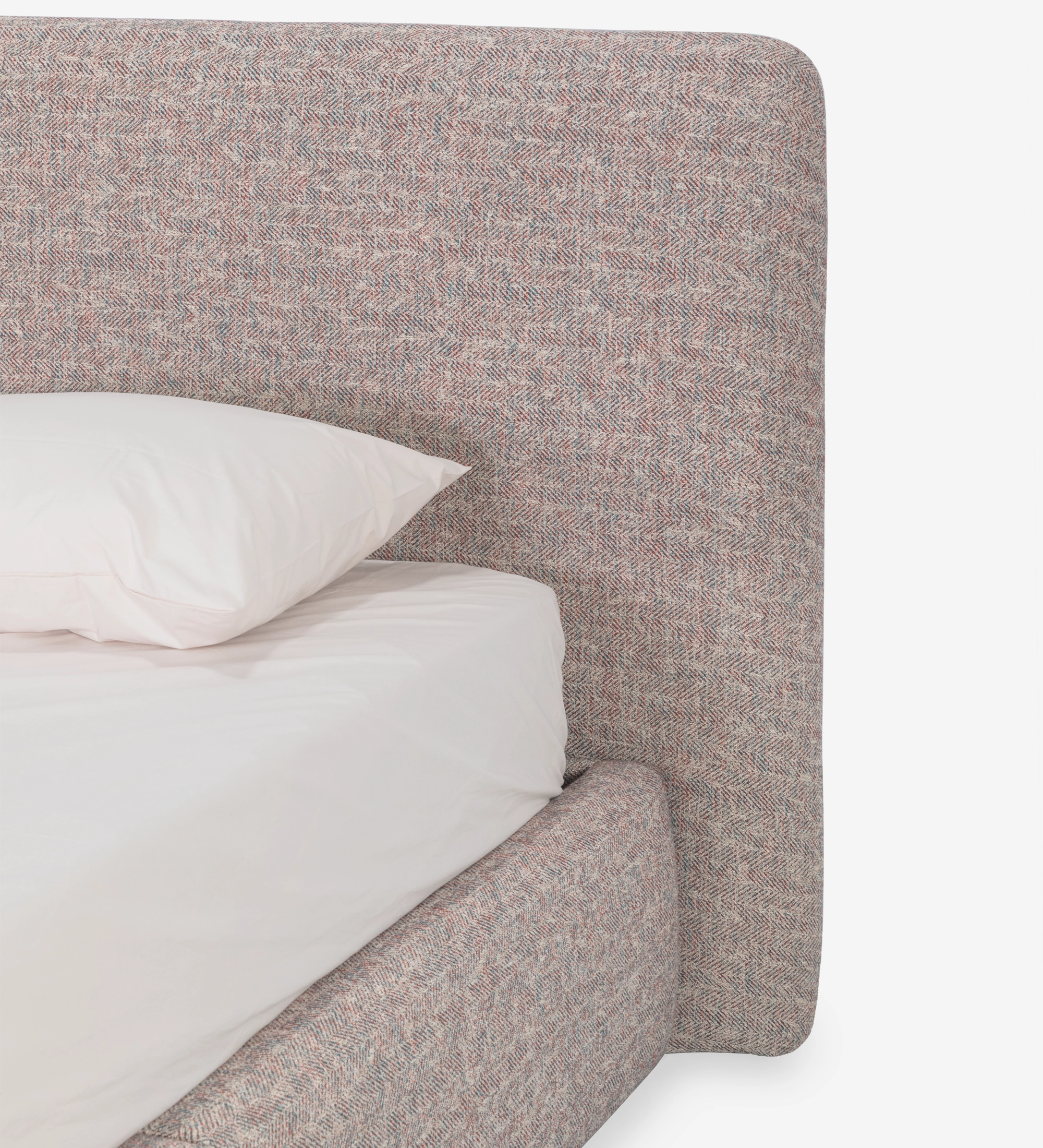 Double bed with short headboard, upholstered in multicolored fabric, primarily red and blue.