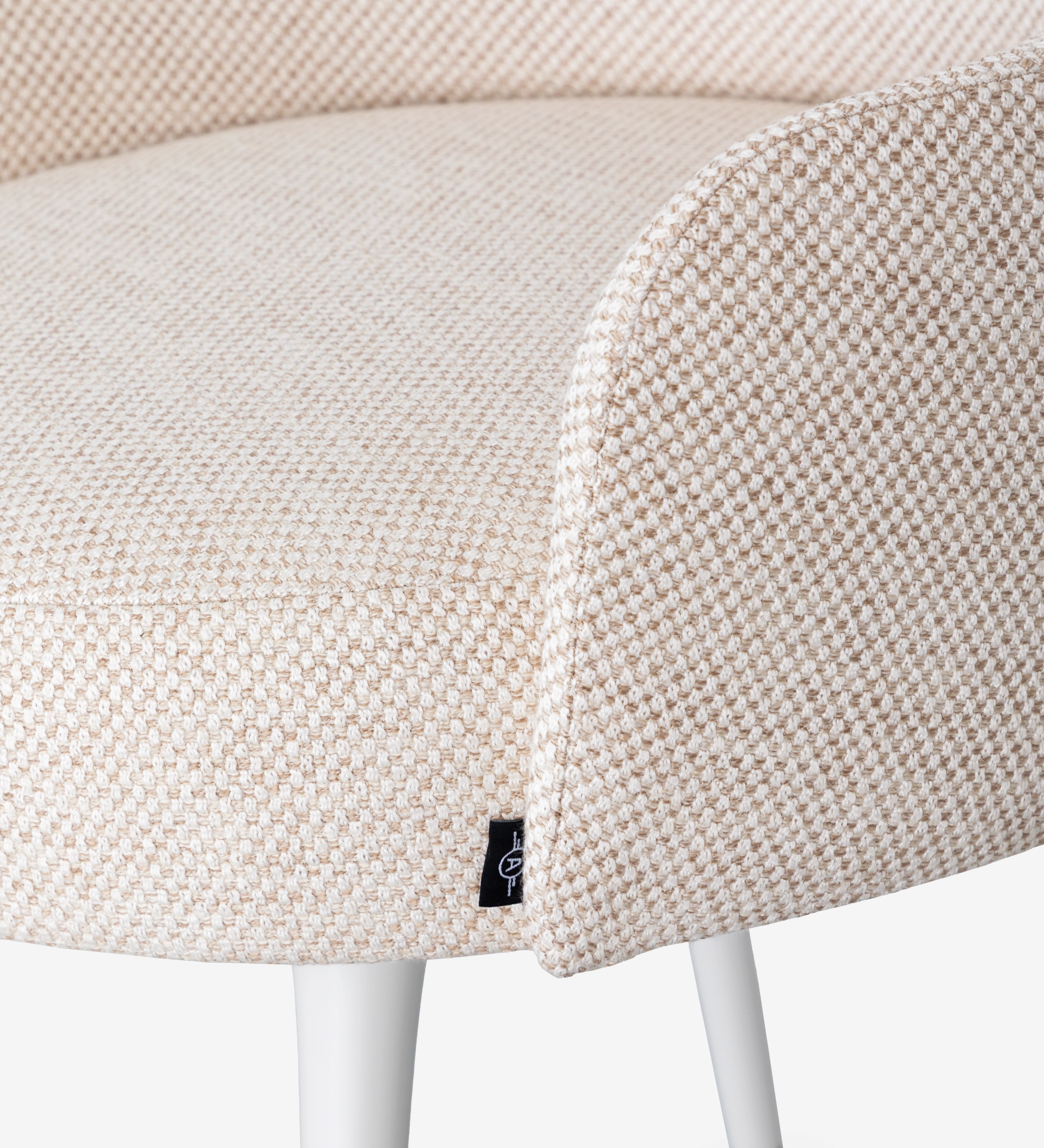 Beige fabric upholstered swivel chair with pearl lacquered feet and gold detailing.