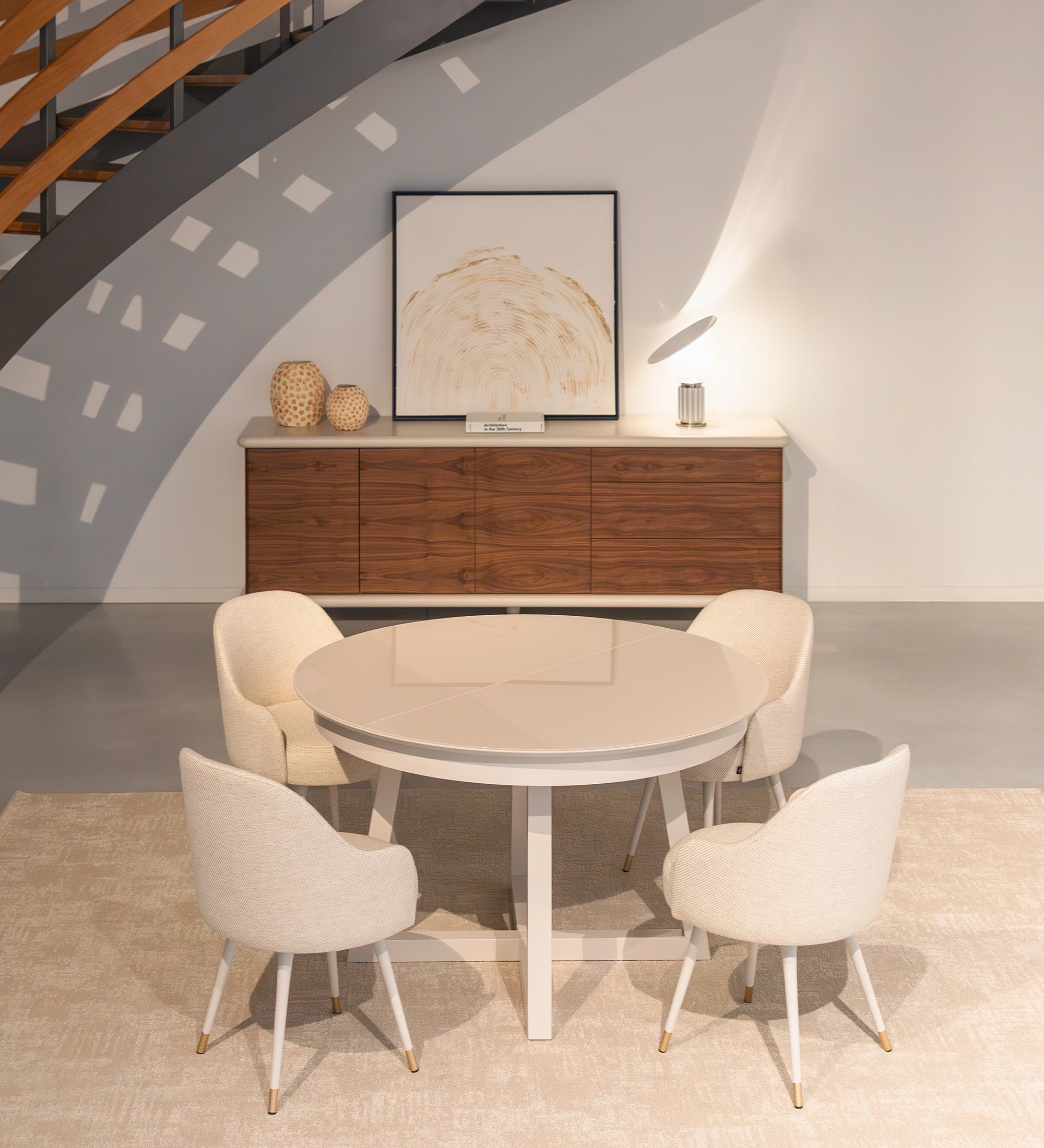 Round extendable dining table in pearl lacquer with glass top and pearl lacquer extension.