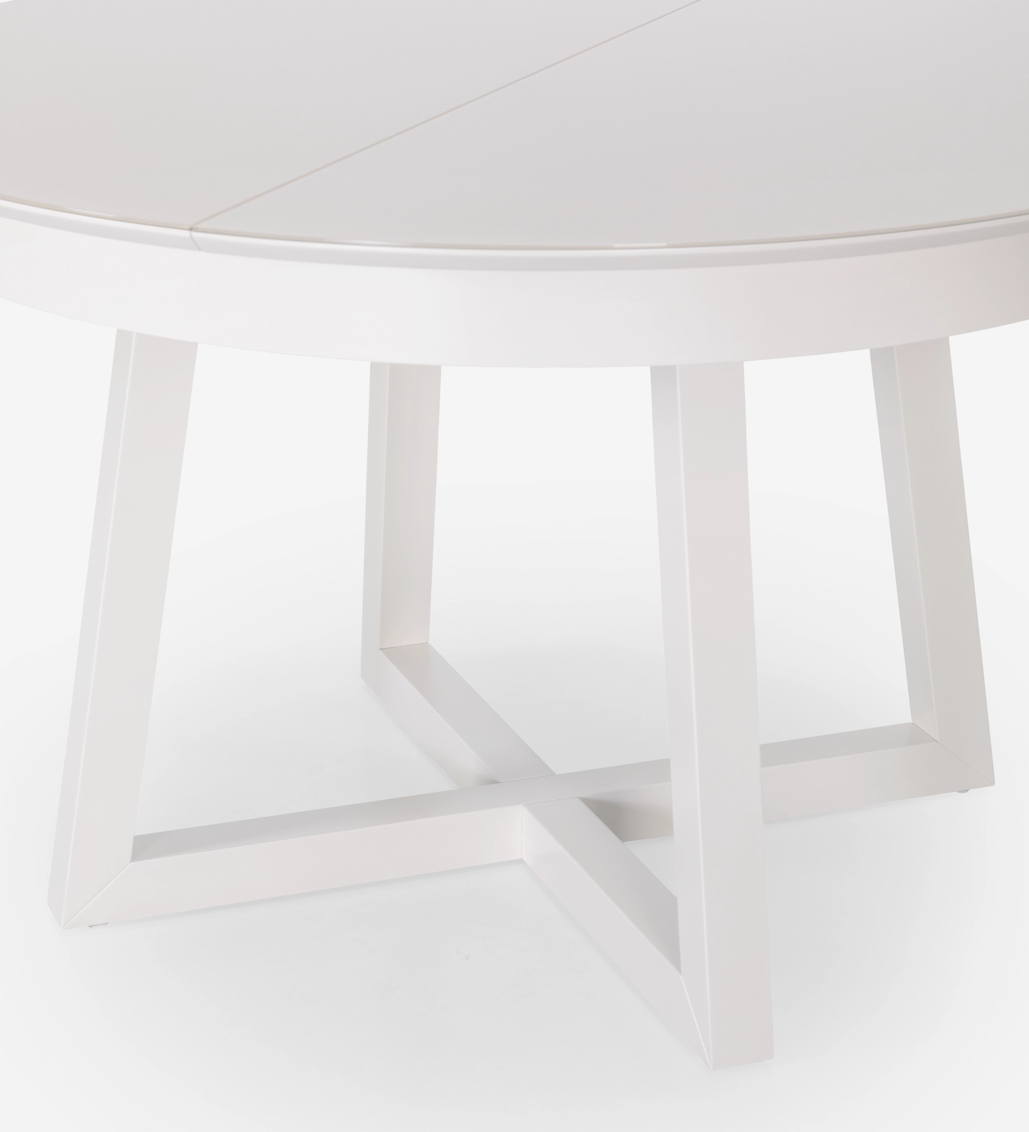 Round extendable dining table in pearl lacquer with glass top and pearl lacquer extension.