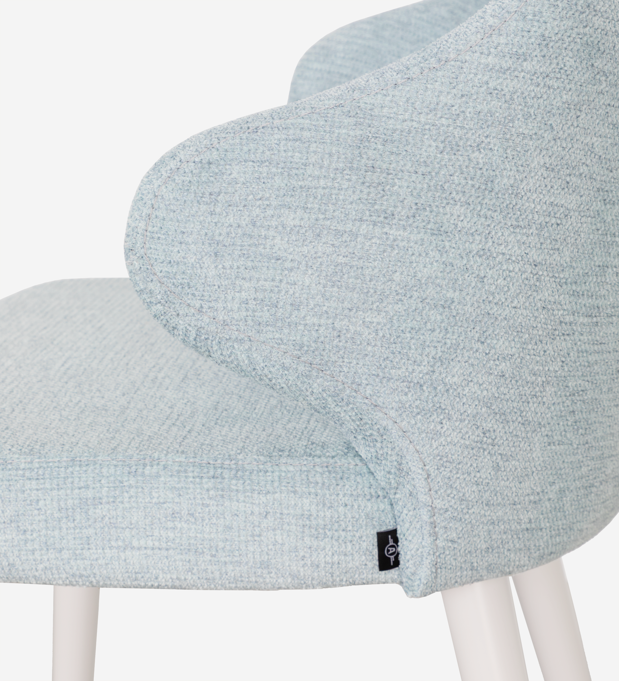 Chair upholstered in blue fabric, feet lacquered in pearl.
