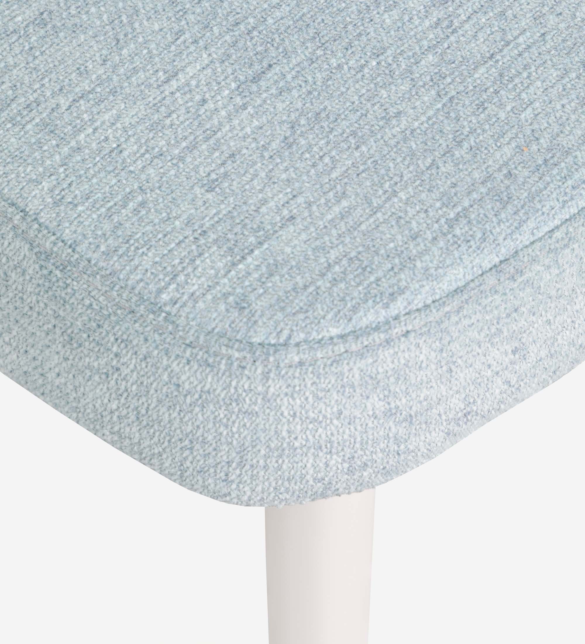 Chair upholstered in blue fabric, feet lacquered in pearl.