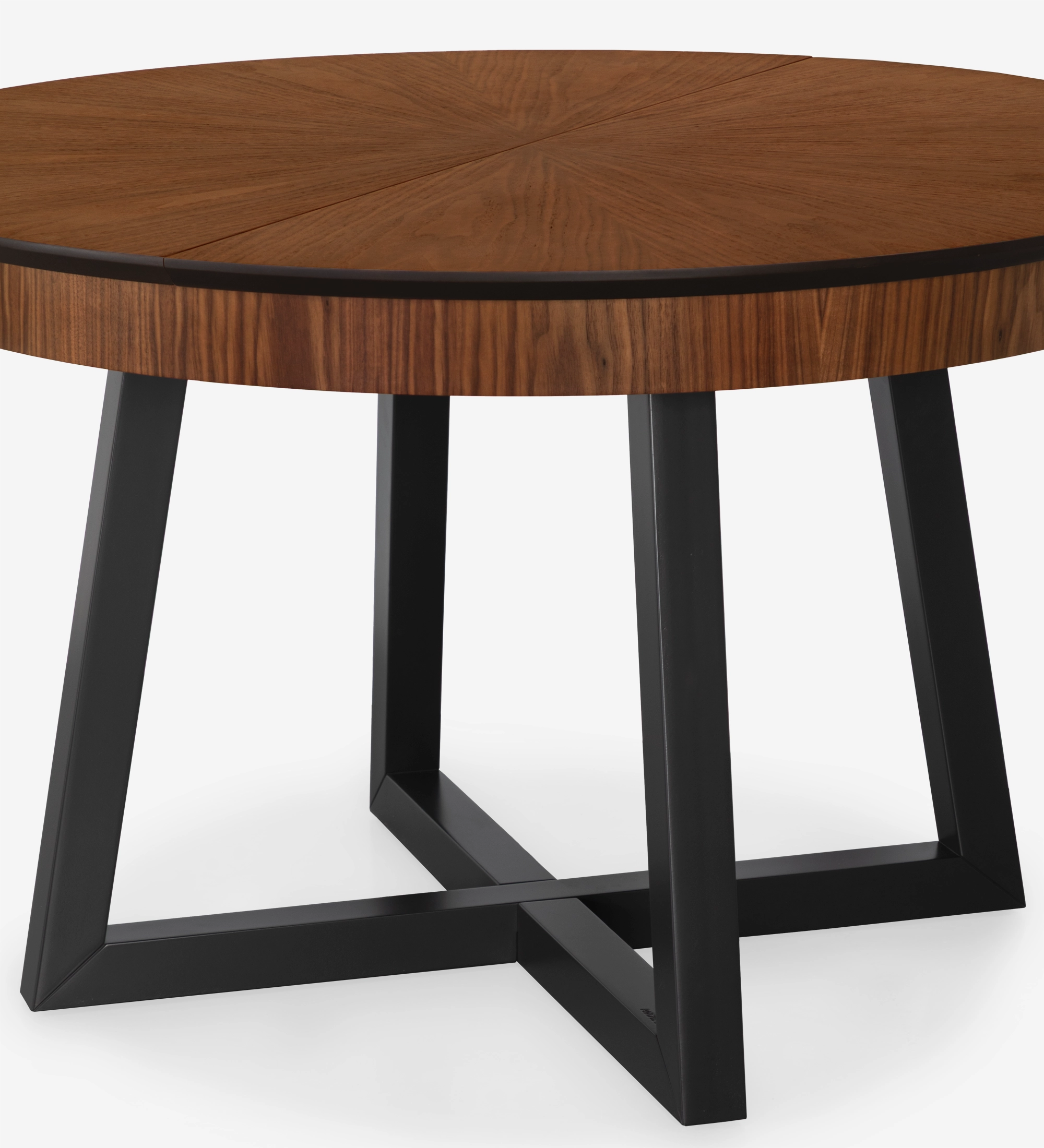 Round extendable dining table with natural walnut top and black lacquered legs.
