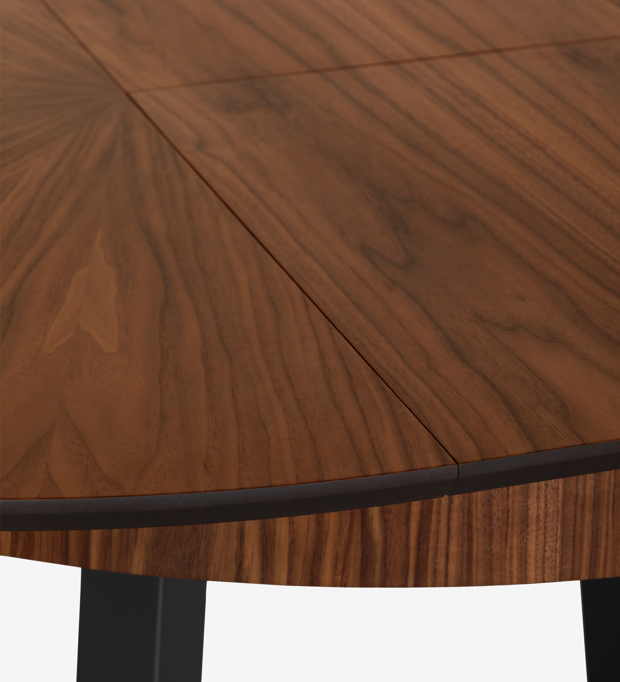 Round extendable dining table with natural walnut top and black lacquered legs.