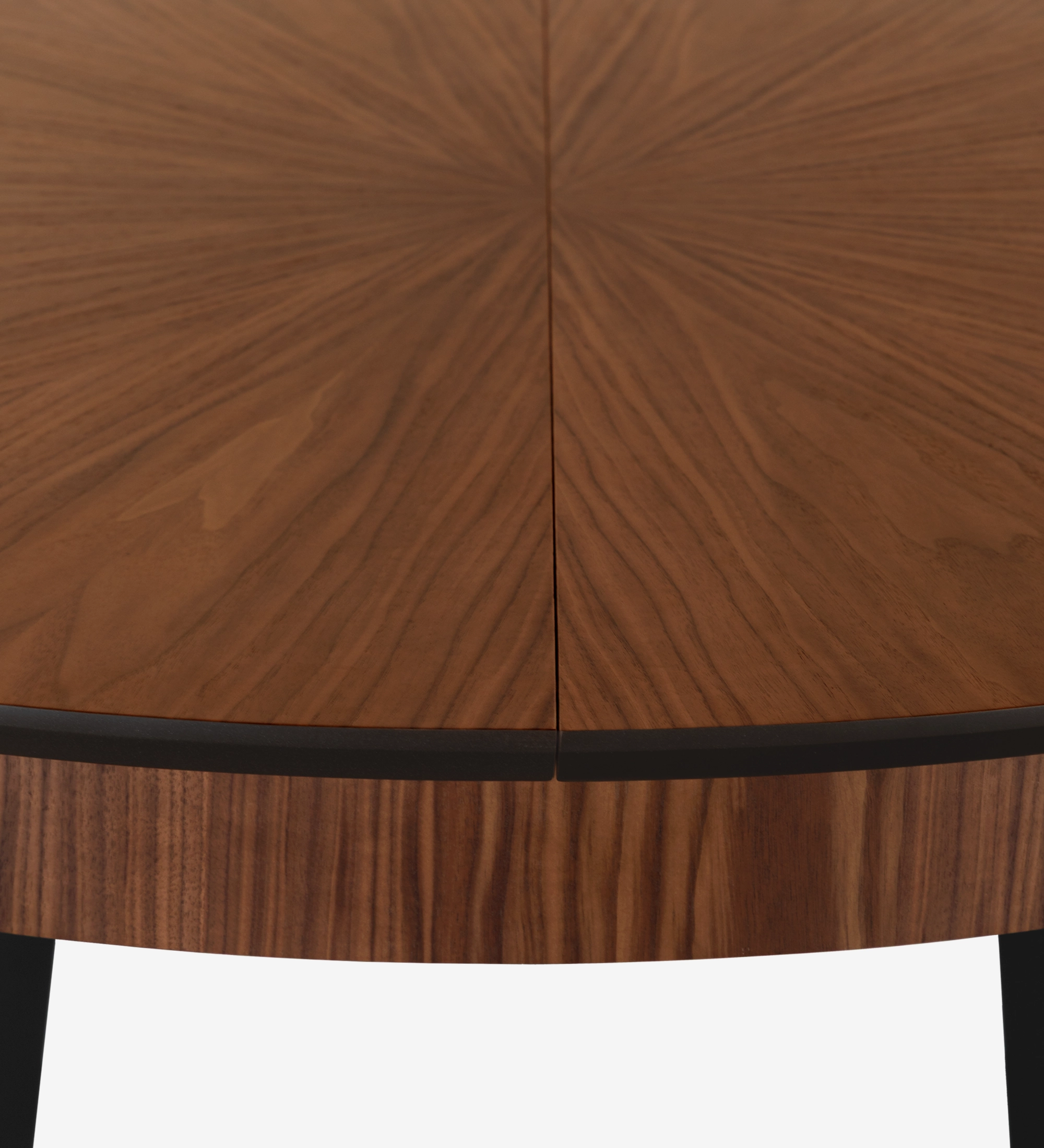 Round extendable dining table with natural walnut top and black lacquered legs.