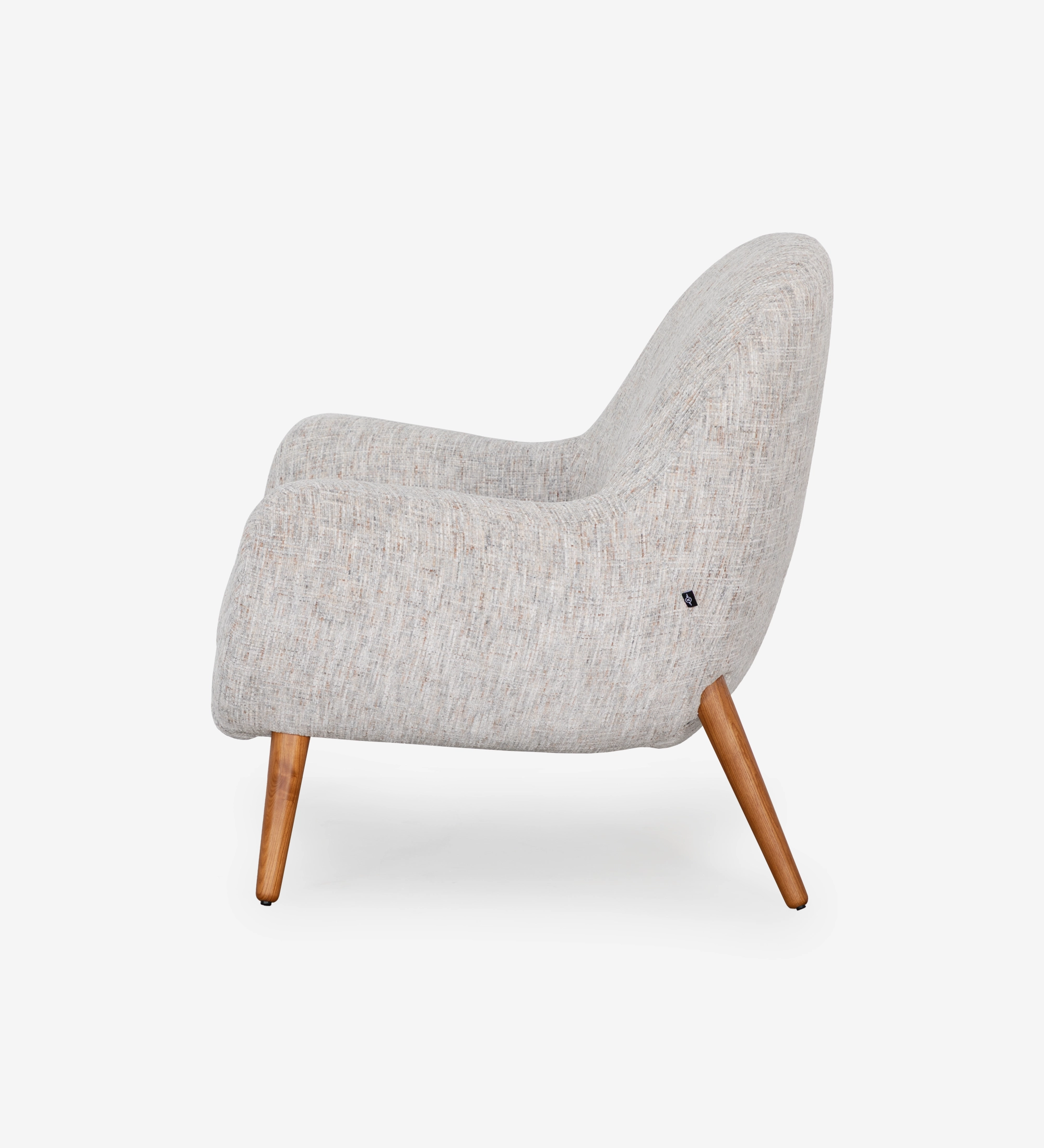 Oslo armchair upholstered in grey velvet-like fabric, with honey-coloured ash wood legs.