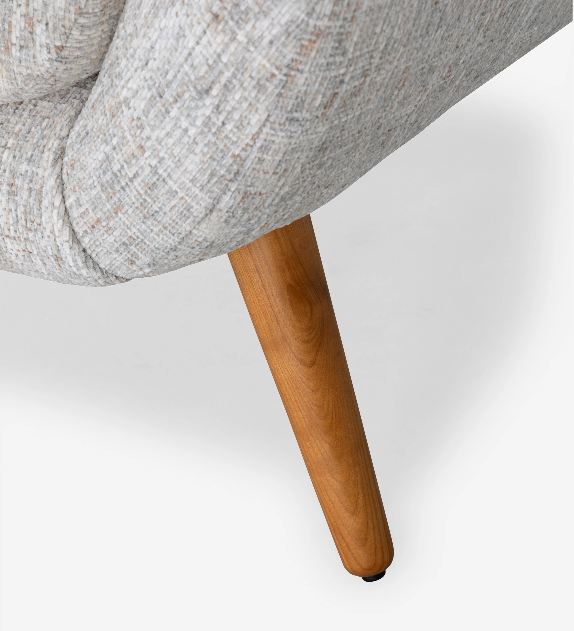 Oslo armchair upholstered in grey velvet-like fabric, with honey-coloured ash wood legs.