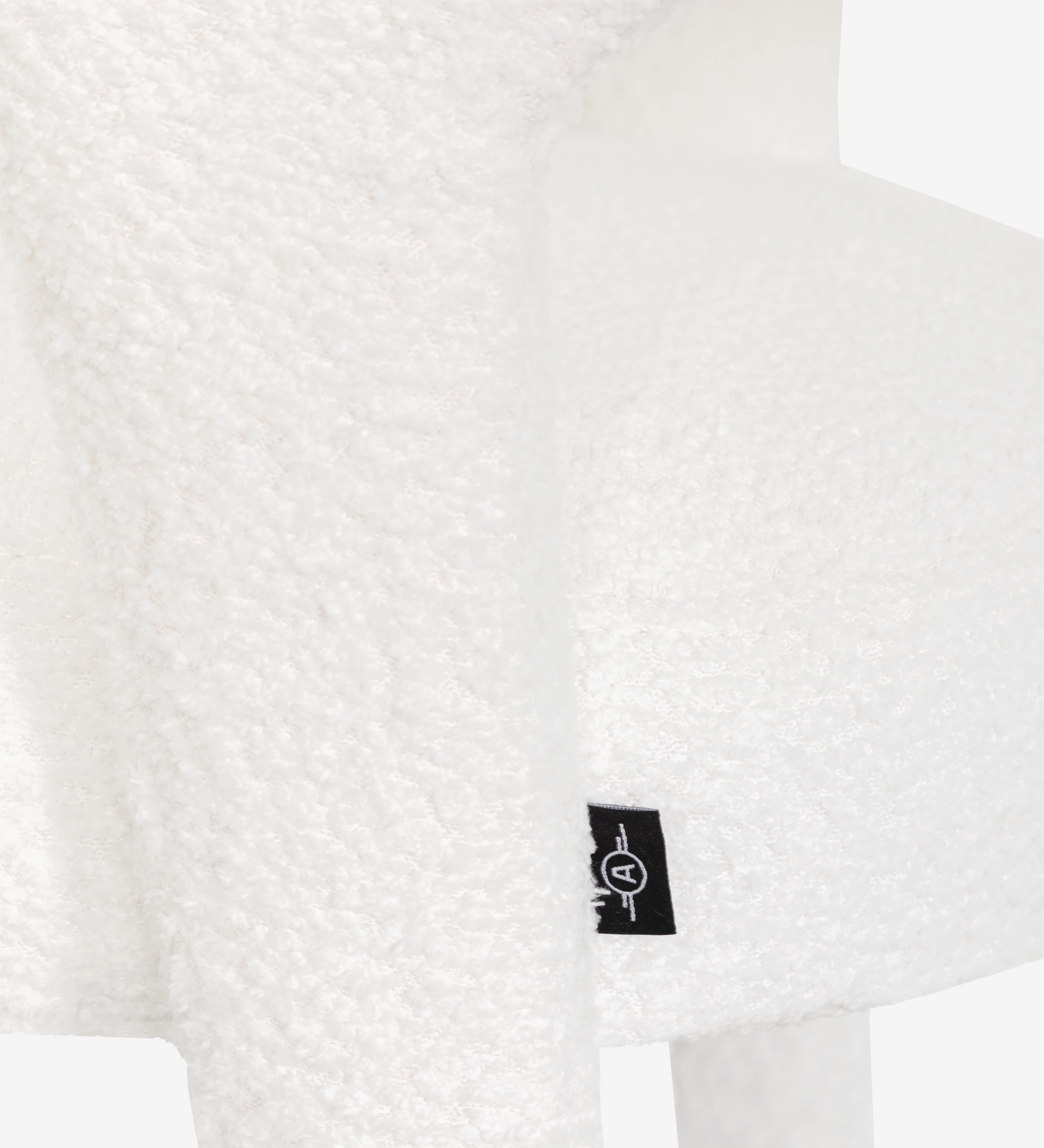 Chair upholstered in white fabric.