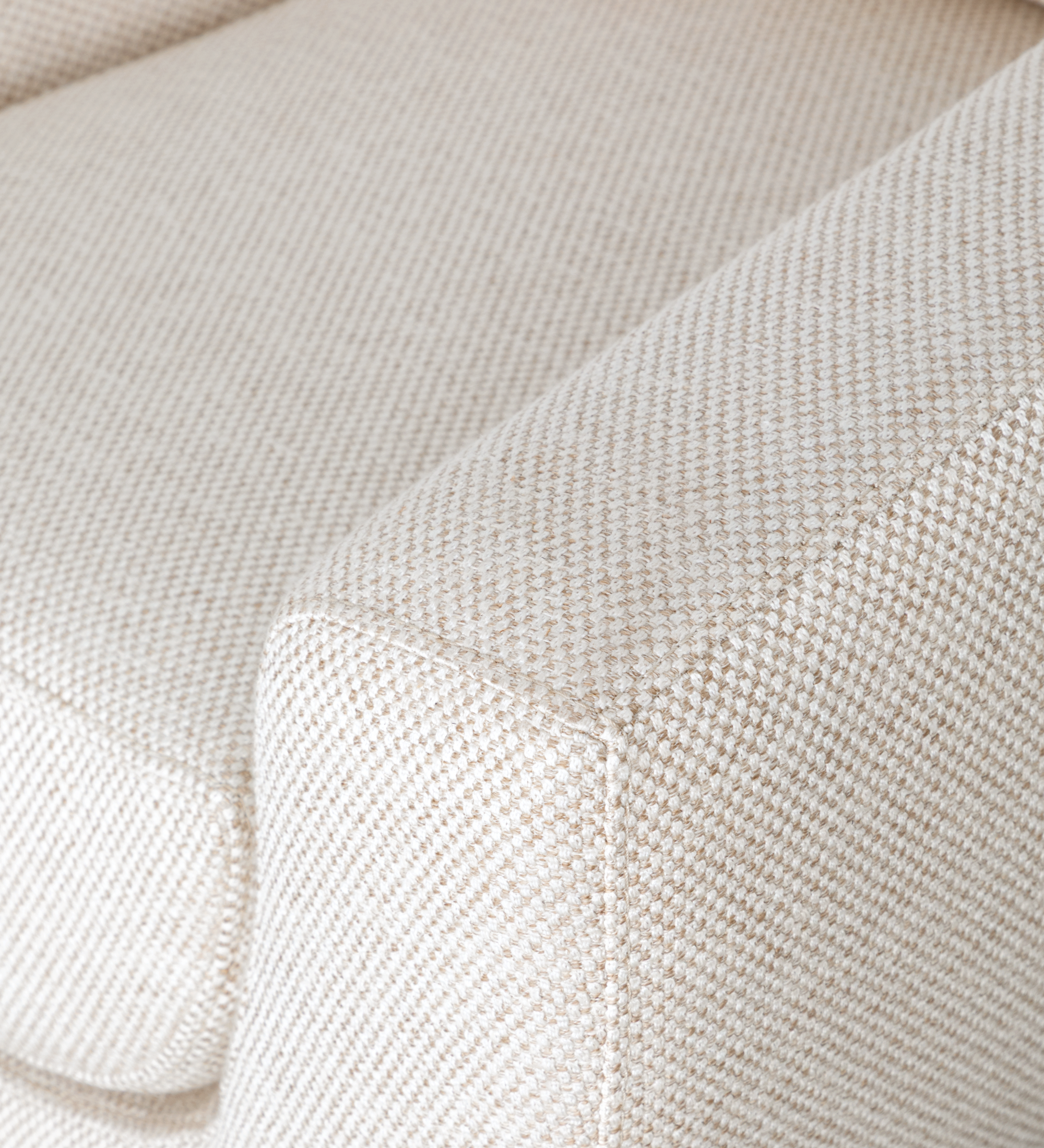 Paris Armchair close-up of beige textured woven fabric on arm and cushion