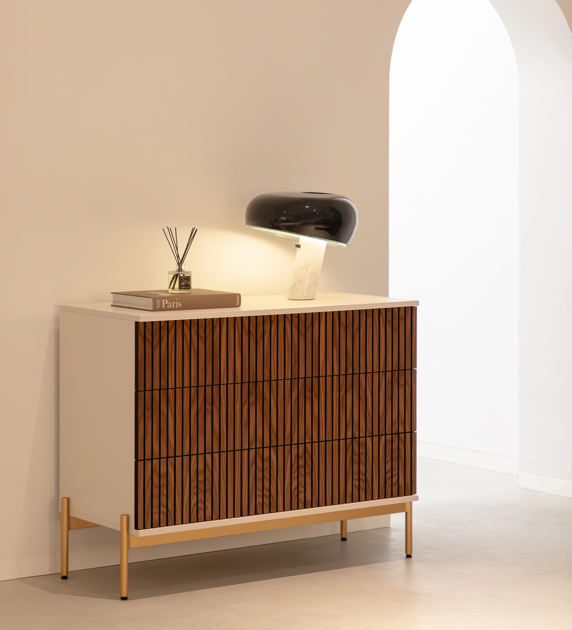Cannes Dresser with grooved walnut drawers, white frame and gold legs, lamp on top
