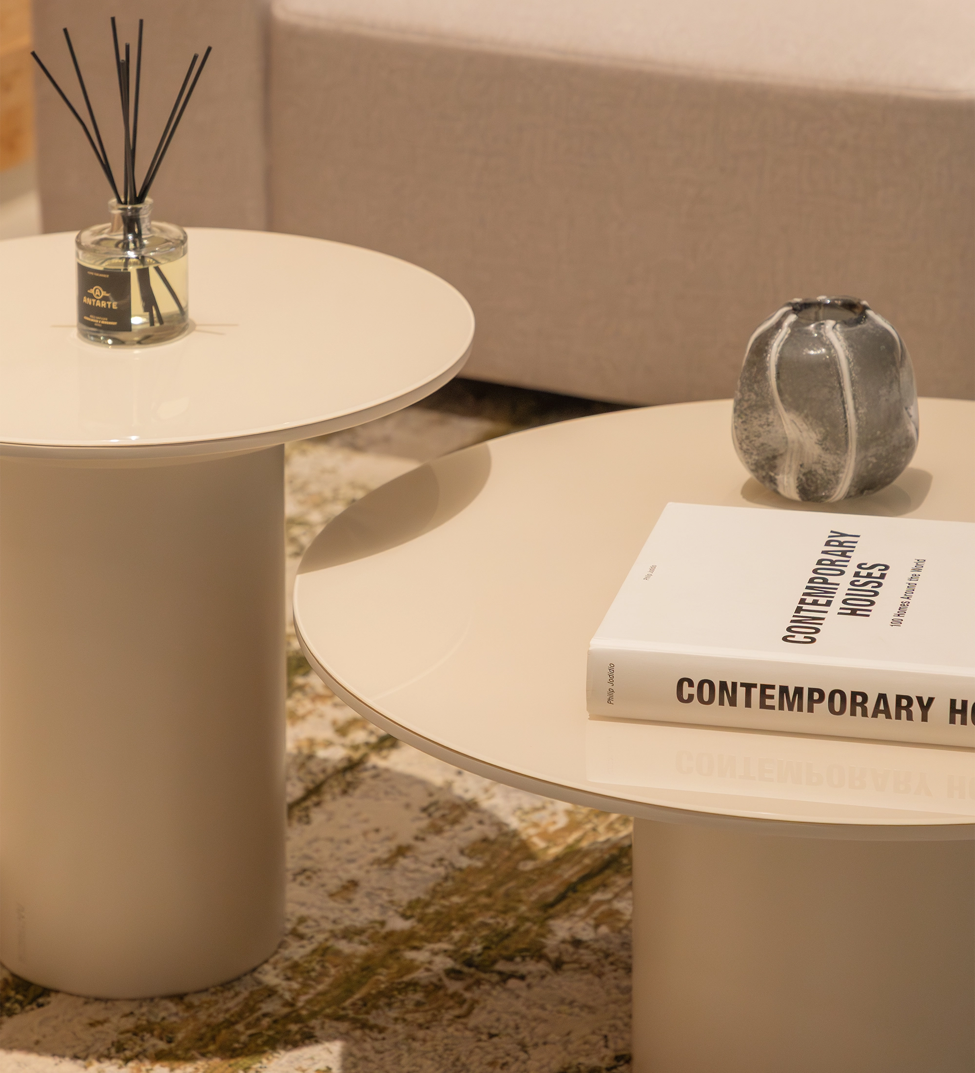 Paris Side Table pair in cream finish with book and ceramic vase