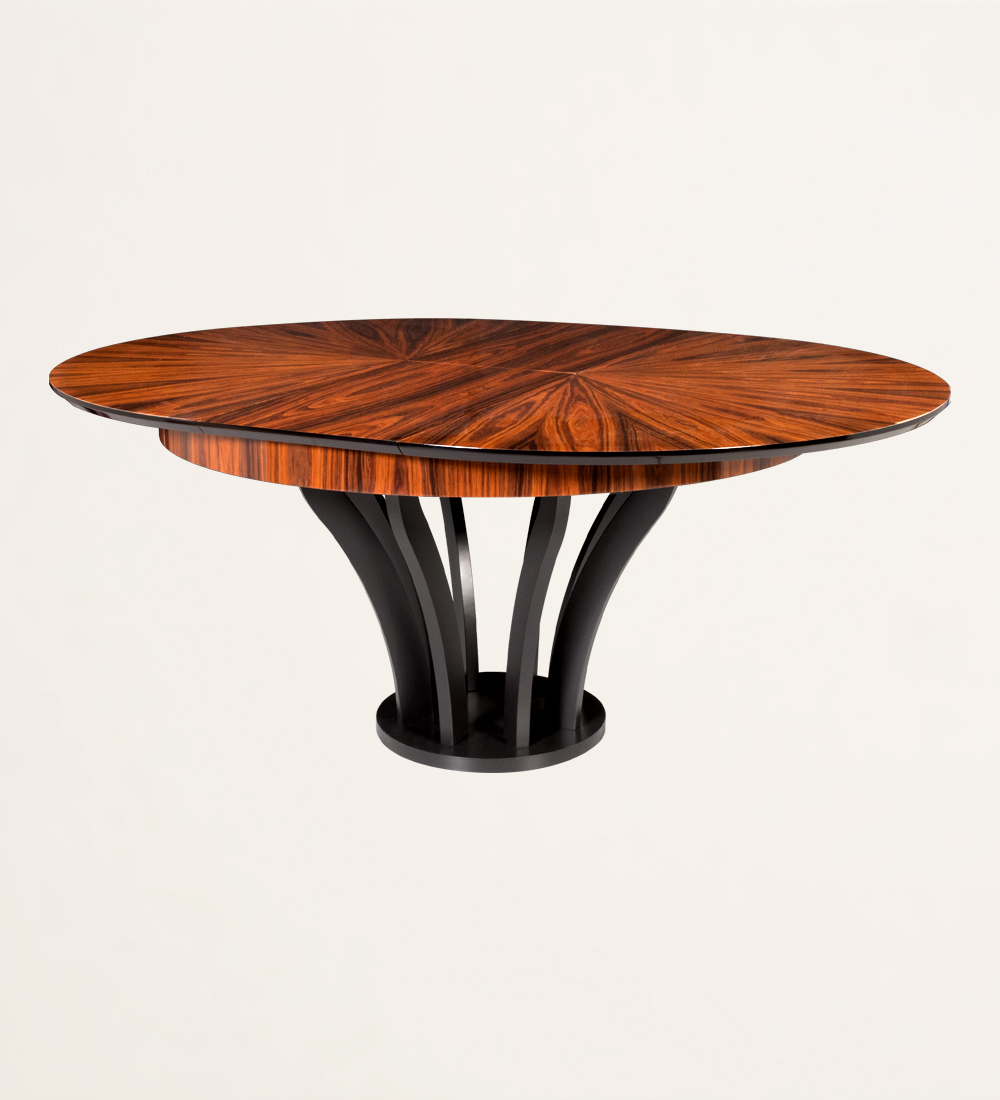 Round extendable dining table with top in high gloss palissander and black lacquered foot.