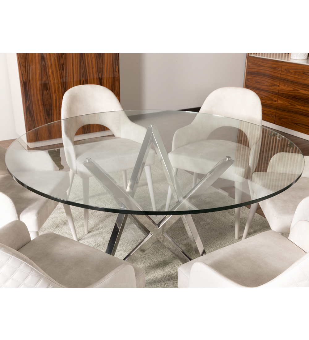 Mesa de comedor redonda con tablero de cristal y pie de acero inoxidable.
