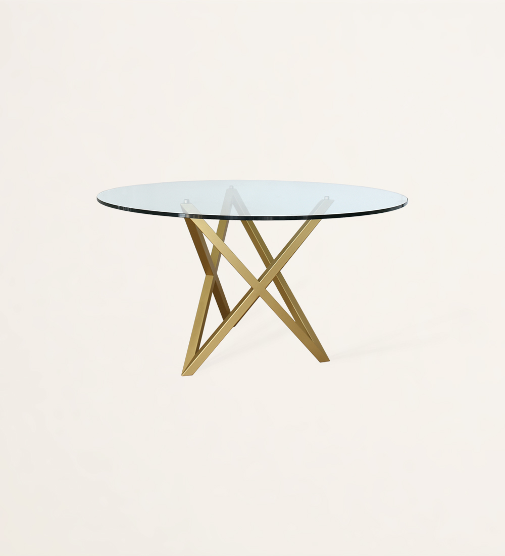 Table de repas ronde avec plateau en verre et pied en métal laqué or.