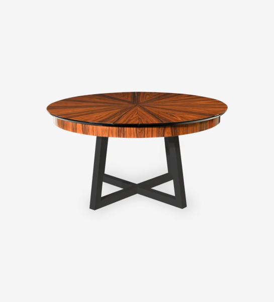 Round extendable dining table with top in high gloss palissander and black lacquered legs.